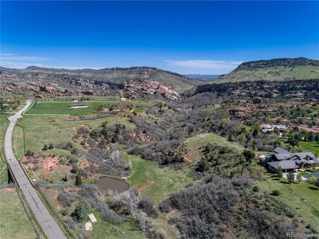 a view of a town with mountains in the background