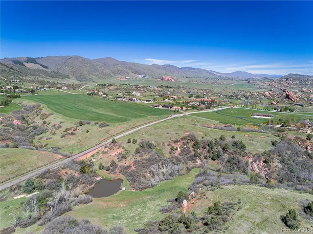 a view of a city with mountains in the background