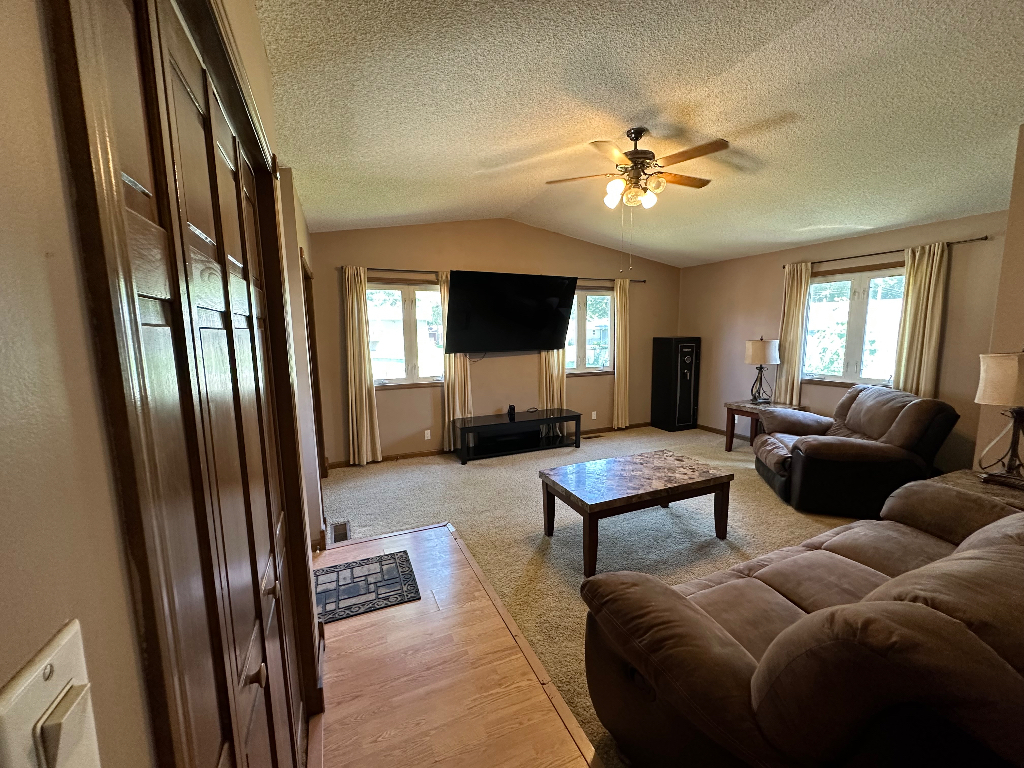 204 Rayjon Drive Oreana, IL 62554 - Photo 7 of 25 a living room with furniture and a flat screen tv