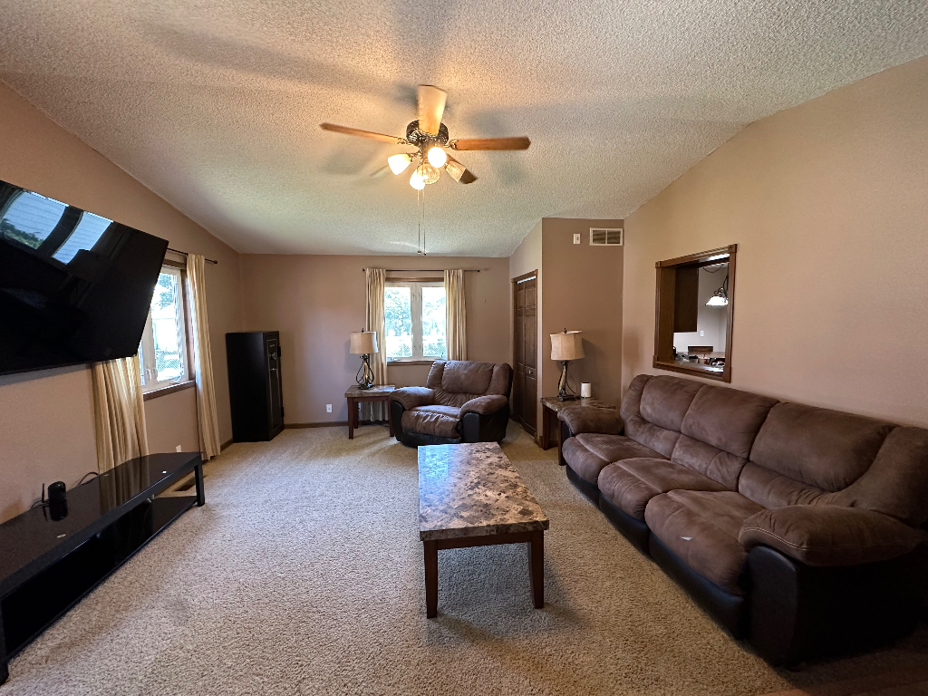 204 Rayjon Drive Oreana, IL 62554 - Photo 8 of 25 a living room with furniture and a flat screen tv