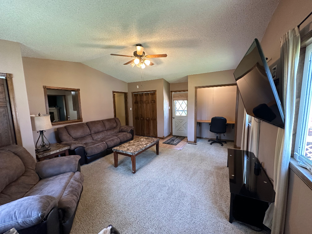 204 Rayjon Drive Oreana, IL 62554 - Photo 9 of 25 a living room with furniture and a flat screen tv