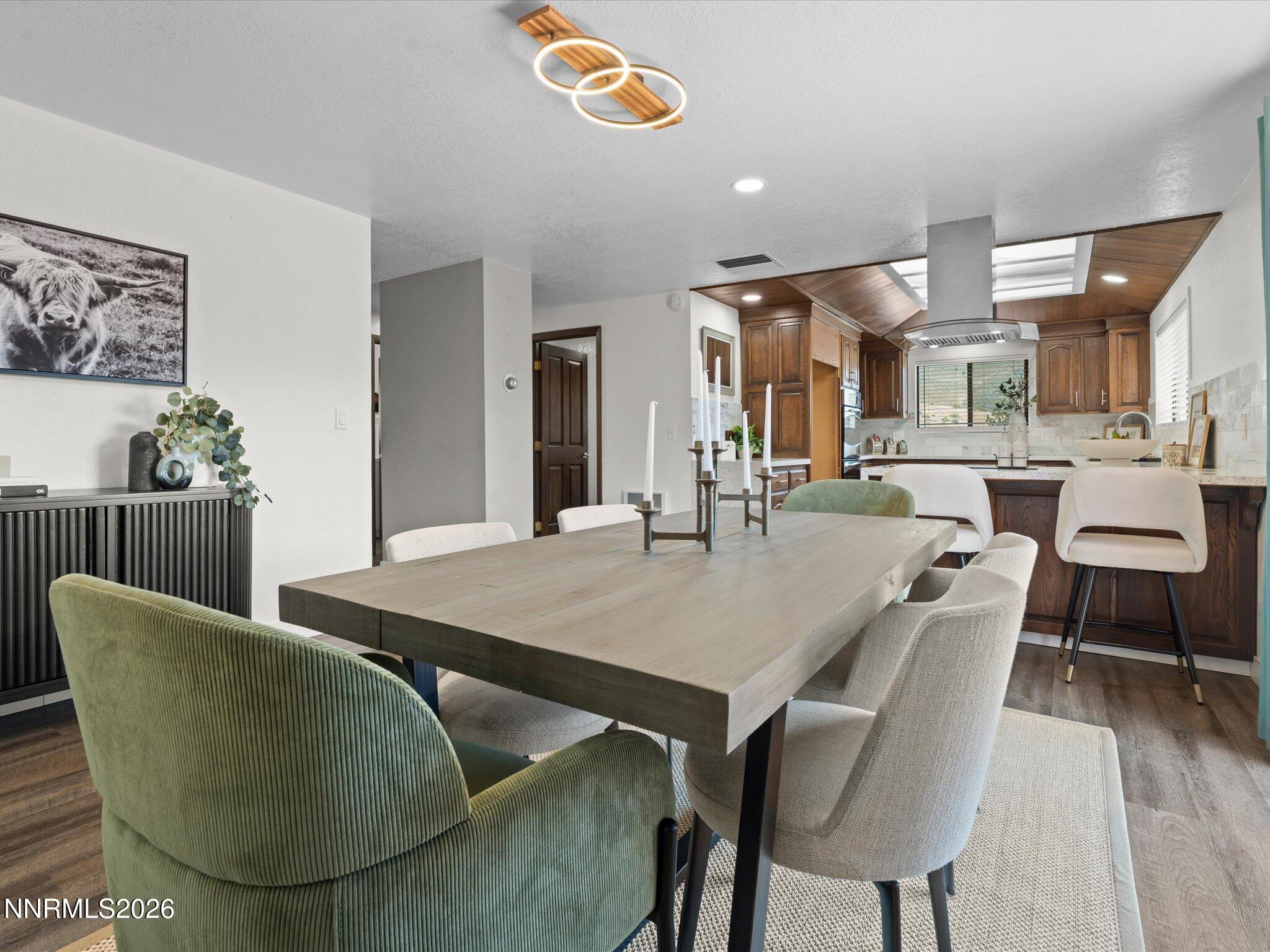 20449 Temelec Way Reno, NV 89521 - Photo 21 of 65 a dining room with furniture and wooden floor