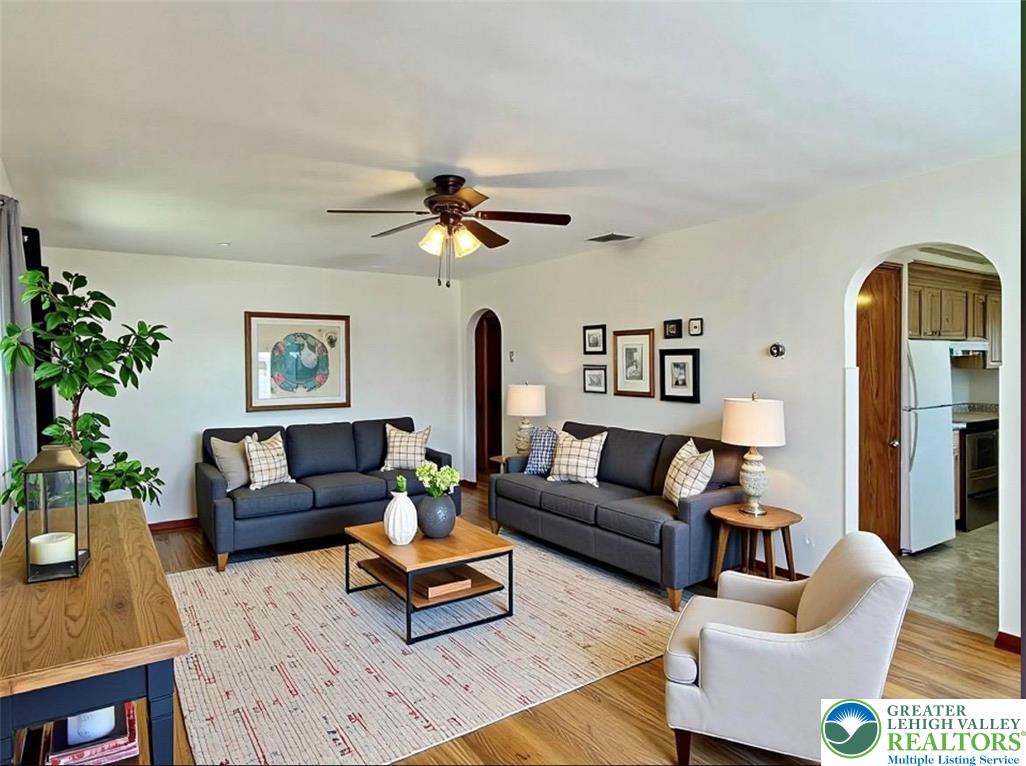 283 Broad Street Bath, PA 18014 - Photo 15 of 36 a living room with furniture and a chandelier