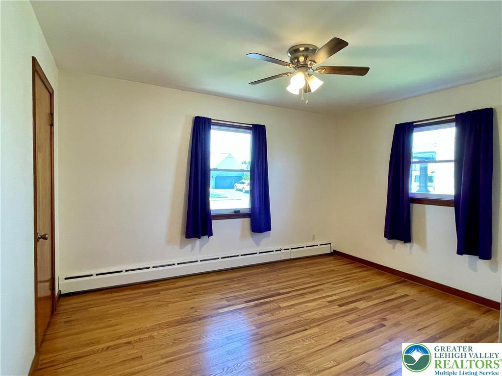 283 Broad Street Bath, PA 18014 - Photo 26 of 36 an empty room with wooden floor and windows