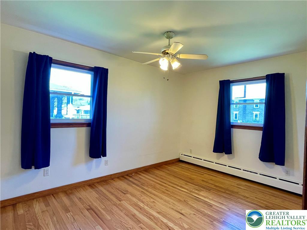 283 Broad Street Bath, PA 18014 - Photo 31 of 36 a view of an empty room with window and wooden floor