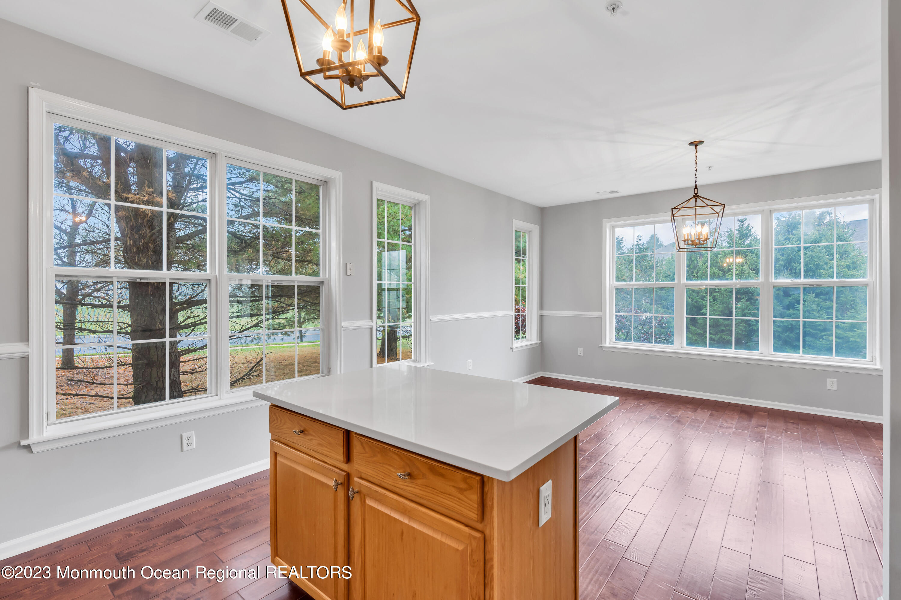 694 St Andrews Place Manalapan, NJ 07726 - Photo 19 of 21 wooden floor in an empty room with a window