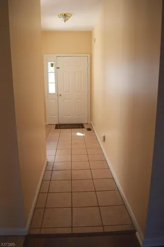 a view of an empty room with windows