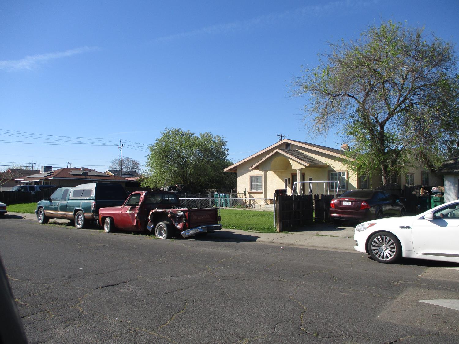 a view of a car parked in front of a house