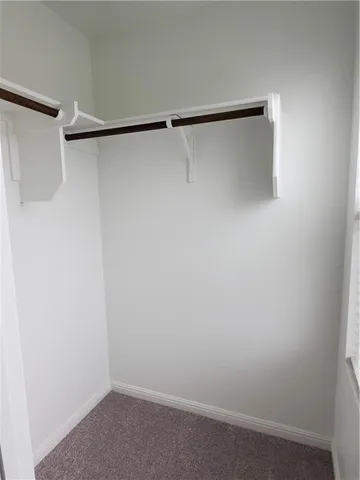 a view of an empty walk in closet