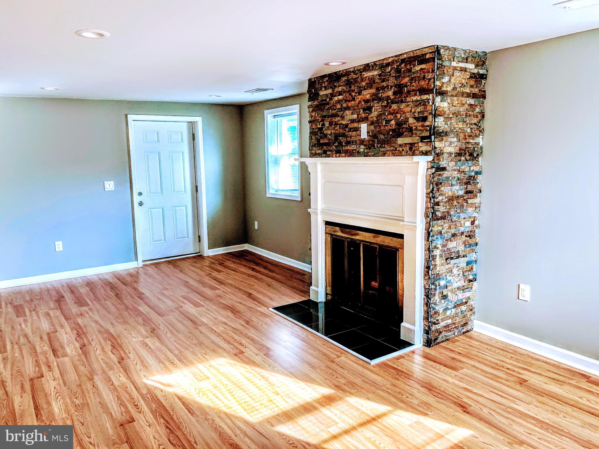 10615 Benchmark Road Fredericksburg, VA 22408 - Photo 4 of 14 Stone fireplace