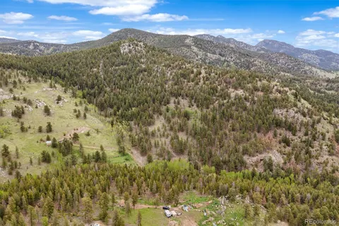 a view of a city with mountains in the background