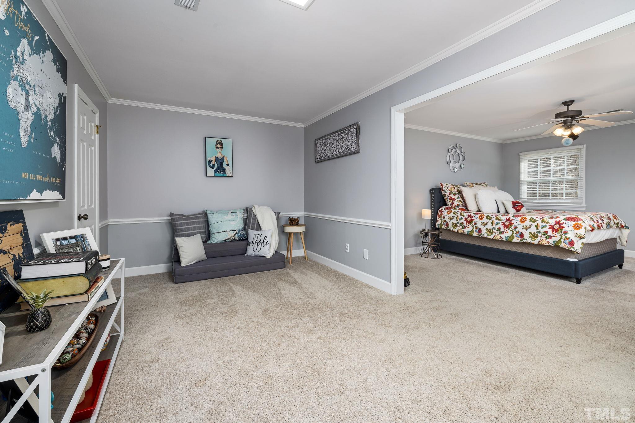1110 Silas Ridge Court Raleigh, NC 27609 - Photo 28 of 43 a bedroom with bed and a couch
