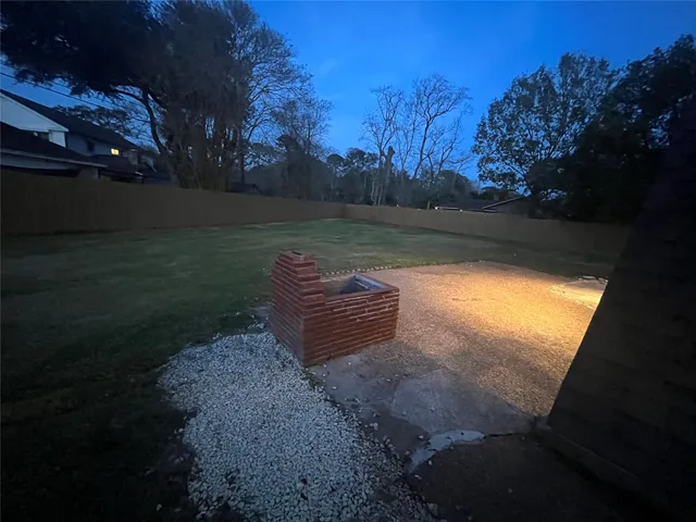 a view of a backyard of the house