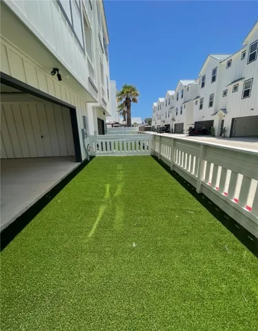 a view of a back yard of a house