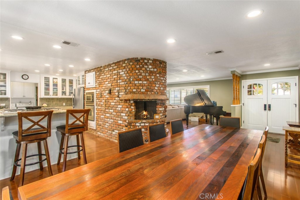 35893 Cornell Drive Yucaipa, CA 92399 - Photo 12 of 39 a living room with fireplace furniture and a wooden floor