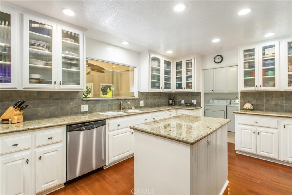 35893 Cornell Drive Yucaipa, CA 92399 - Photo 14 of 39 a kitchen with a sink stove and cabinets