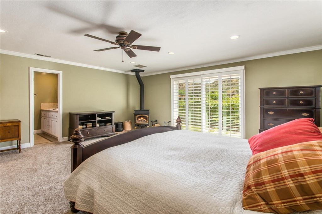 35893 Cornell Drive Yucaipa, CA 92399 - Photo 21 of 39 a bedroom with a bed and a window