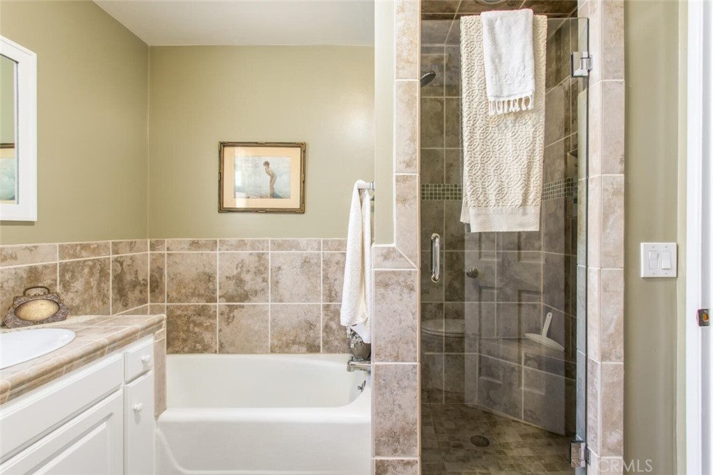 35893 Cornell Drive Yucaipa, CA 92399 - Photo 27 of 39 a bathroom with a bathtub and a shower