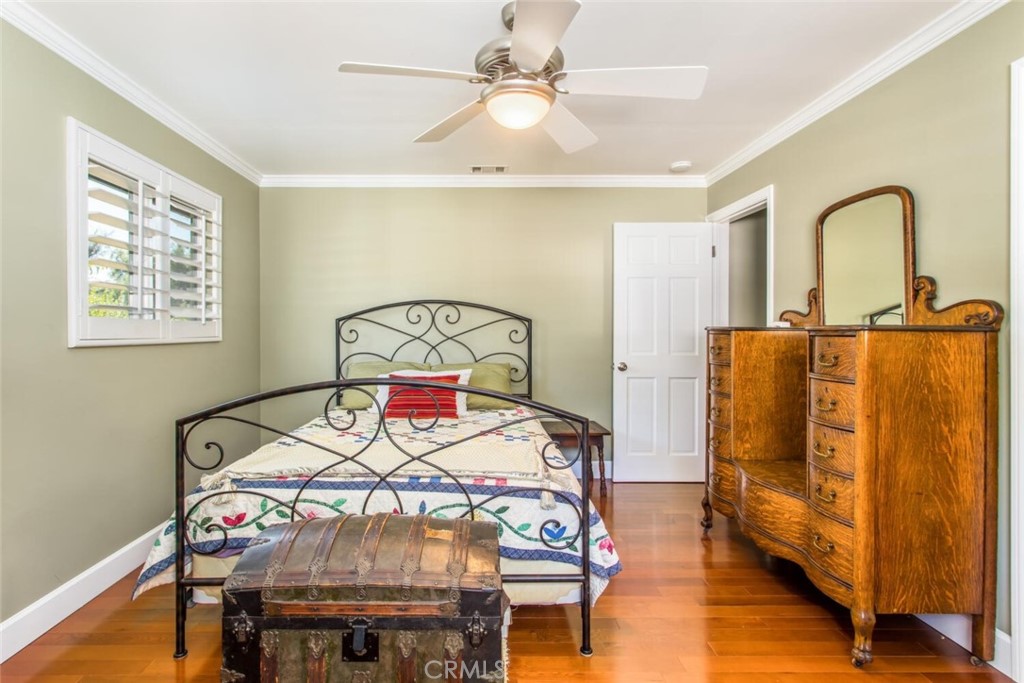 35893 Cornell Drive Yucaipa, CA 92399 - Photo 29 of 39 a living room with furniture a dining table and wooden floor
