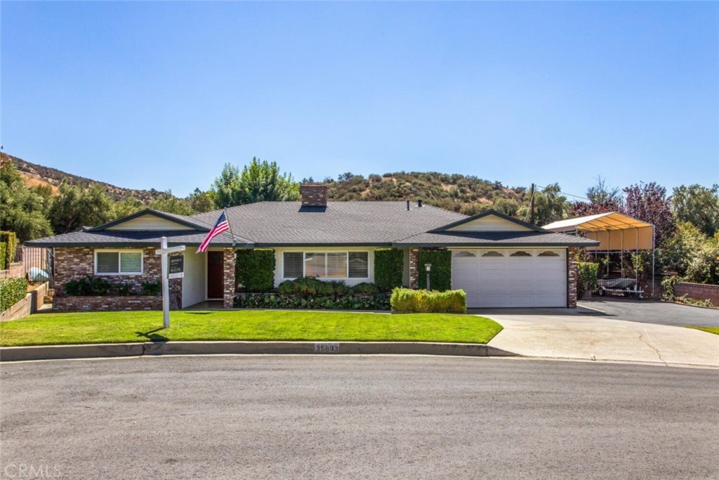 35893 Cornell Drive Yucaipa, CA 92399 - Photo 3 of 39 a front view of a house with a yard and potted plants