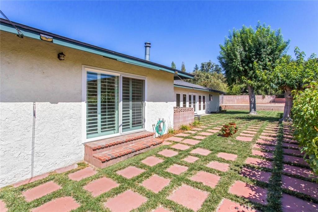 35893 Cornell Drive Yucaipa, CA 92399 - Photo 32 of 39 a front view of a house with a yard