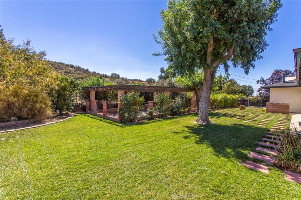 35893 Cornell Drive Yucaipa, CA 92399 - Photo 35 of 39 a view of a house with backyard and a tree