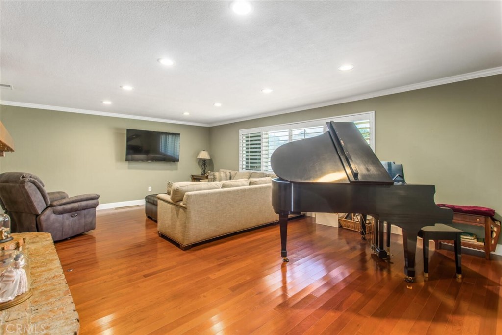 35893 Cornell Drive Yucaipa, CA 92399 - Photo 6 of 39 a living room with furniture and a wooden floor