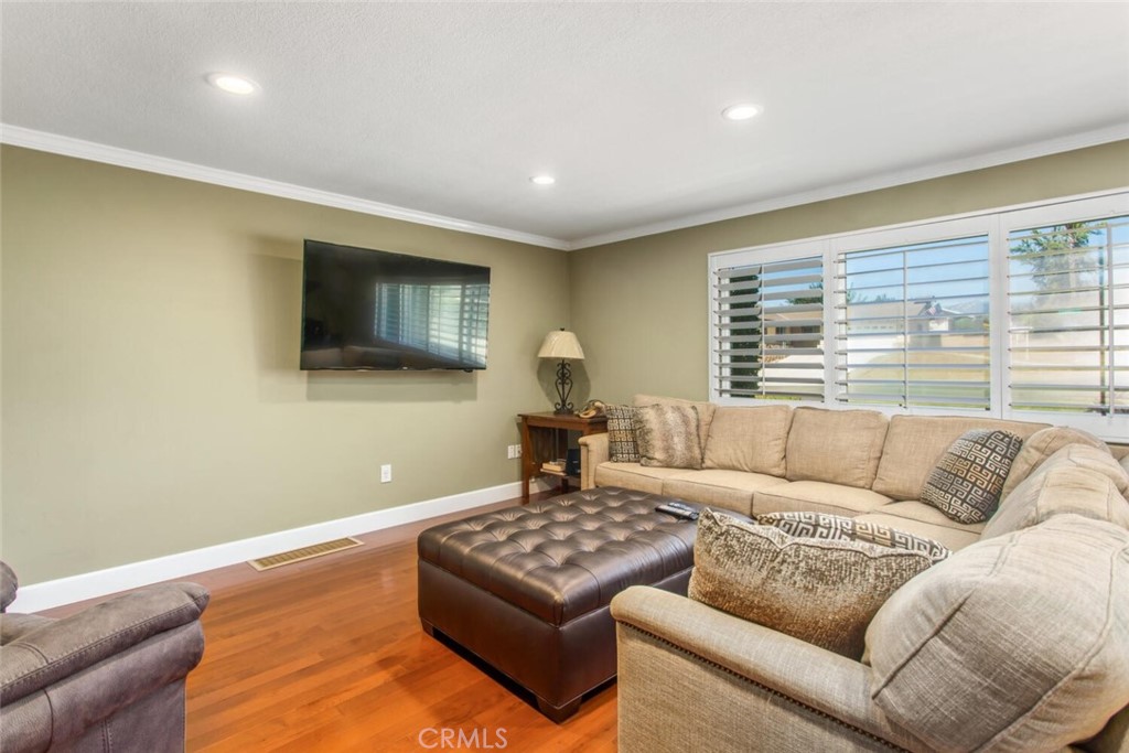35893 Cornell Drive Yucaipa, CA 92399 - Photo 7 of 39 a living room with couches couches and a flat screen tv