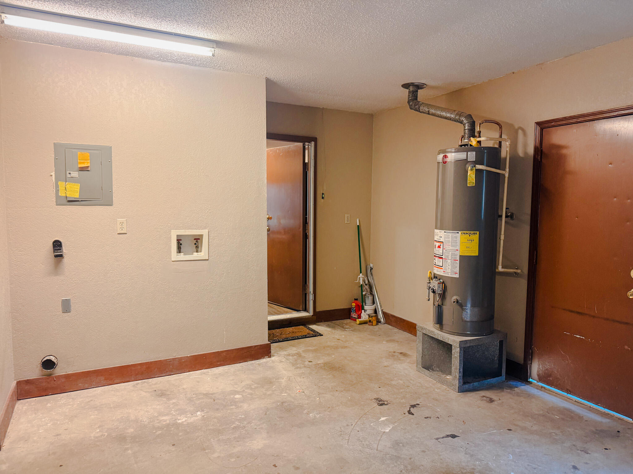 102 Springwood Circle Crestview, FL 32536 - Photo 21 of 21 Garage with laundry and hot water heater
