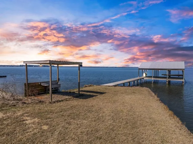 a view of a backyard with sitting area