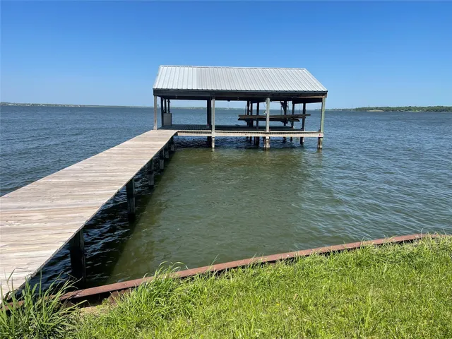 a view of a swimming pool with chairs