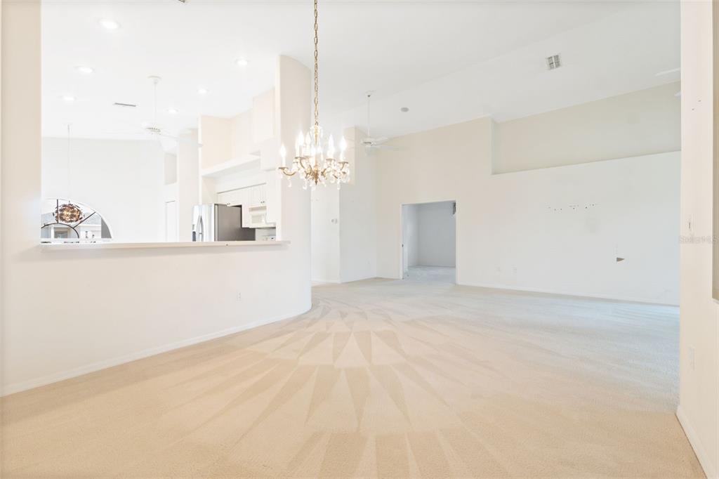 10149 Duffy Circle Weeki Wachee, FL 34613 - Photo 12 of 59 a view of a kitchen with kitchen island and natural light