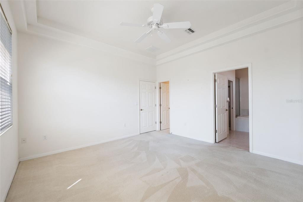 10149 Duffy Circle Weeki Wachee, FL 34613 - Photo 22 of 59 an empty room with an entryway and fan