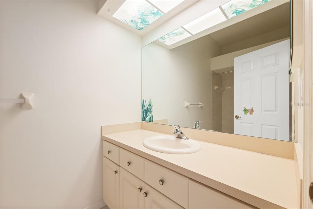 10149 Duffy Circle Weeki Wachee, FL 34613 - Photo 28 of 59 a bathroom with a sink and a mirror