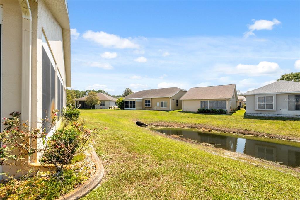 10149 Duffy Circle Weeki Wachee, FL 34613 - Photo 36 of 59 a view of a swimming pool with an ocean view