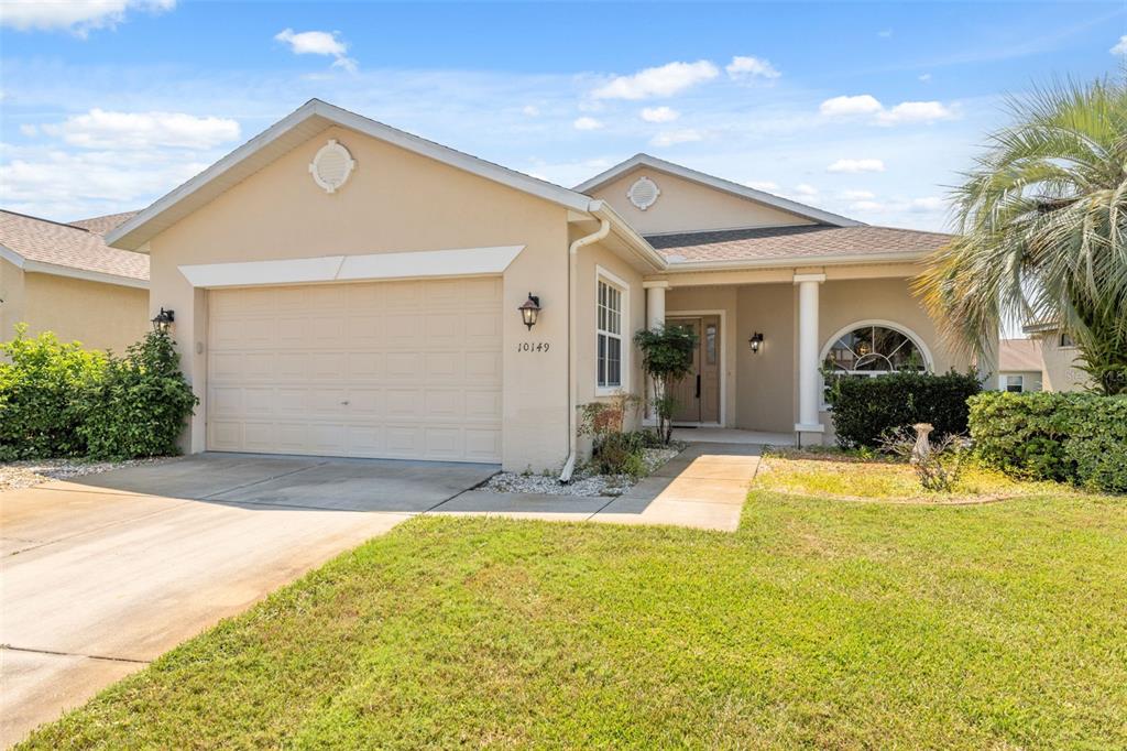 10149 Duffy Circle Weeki Wachee, FL 34613 - Photo 40 of 59 a front view of a house with a yard