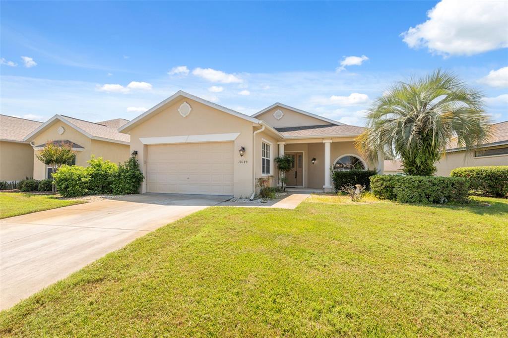 10149 Duffy Circle Weeki Wachee, FL 34613 - Photo 41 of 59 a front view of a house with a yard