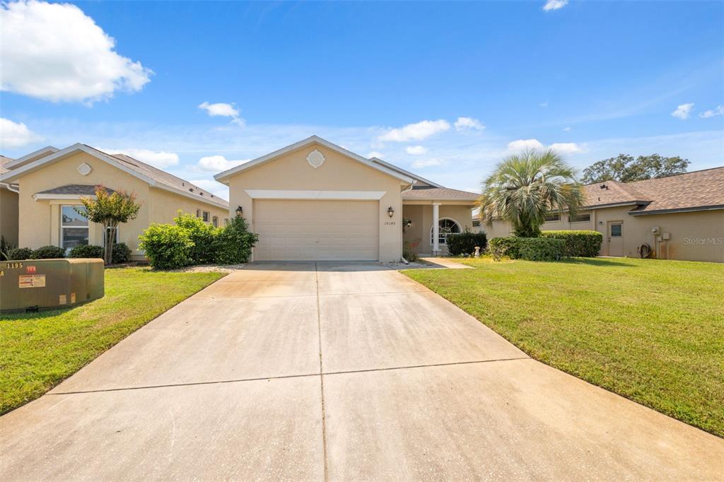 10149 Duffy Circle Weeki Wachee, FL 34613 - Photo 42 of 59 a front view of a house with a yard
