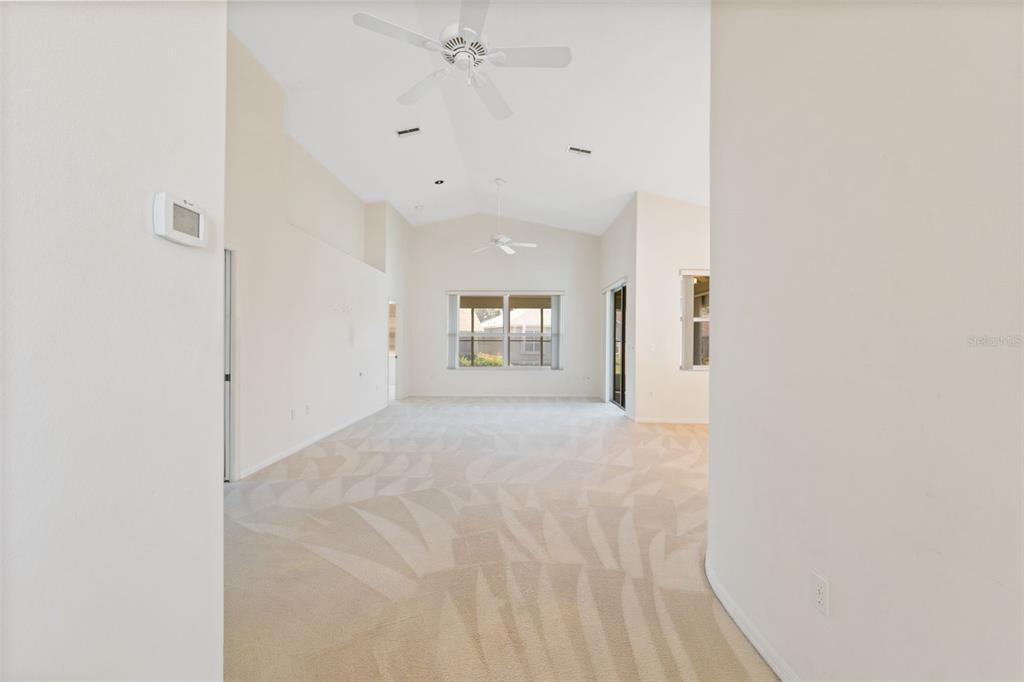 10149 Duffy Circle Weeki Wachee, FL 34613 - Photo 6 of 59 a view of an empty room with chandelier