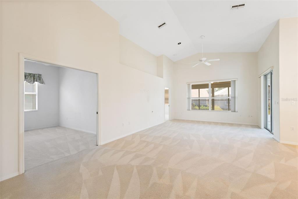 10149 Duffy Circle Weeki Wachee, FL 34613 - Photo 9 of 59 a view of an empty room with a window