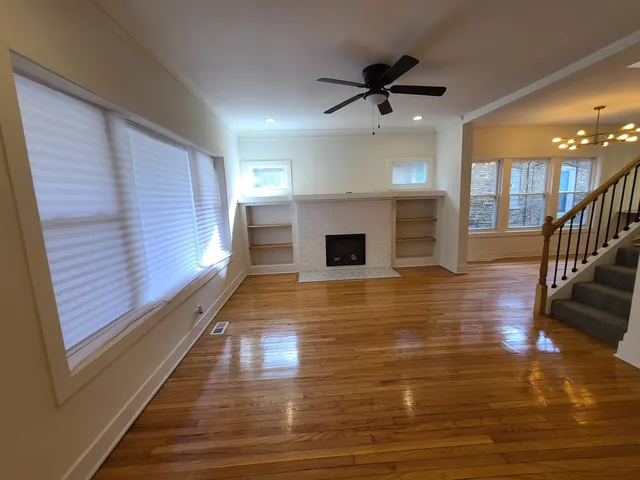 a view of livingroom with hardwood floor and ceiling fan