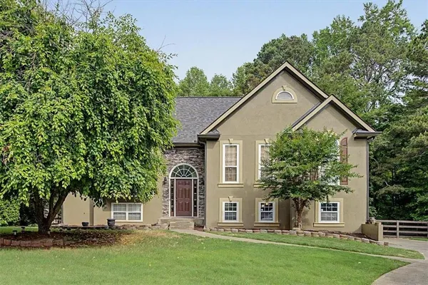 front view of a house with a yard