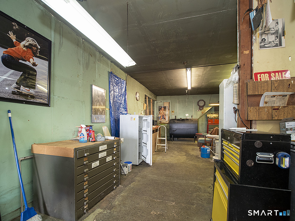 1052 Dixwell Avenue Hamden, CT 06514 - Photo 16 of 25 a room with furniture and gym equipment