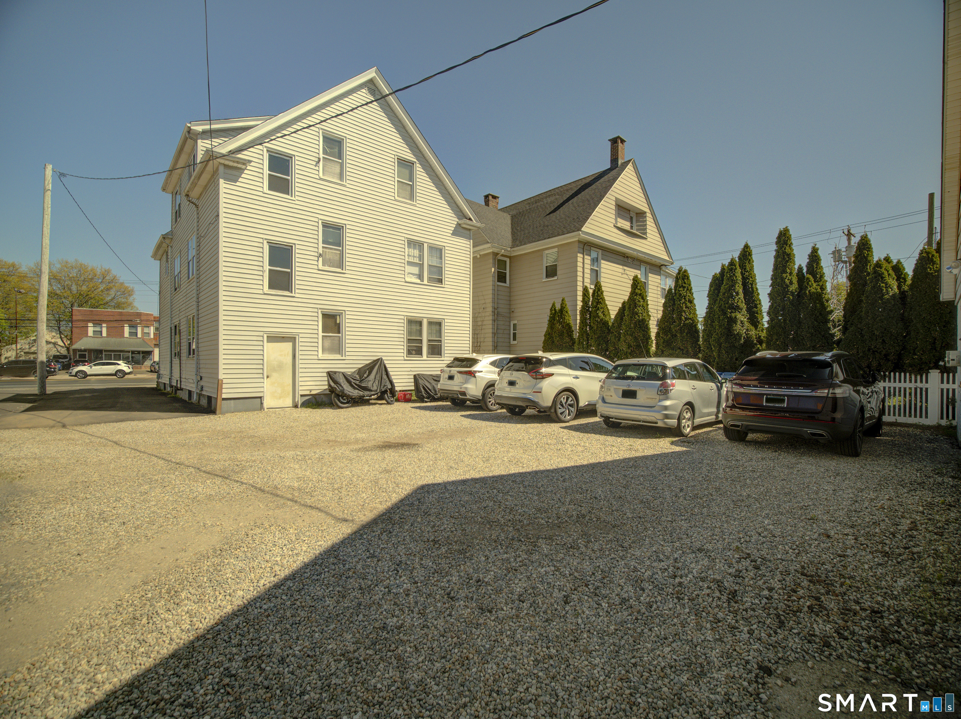 1052 Dixwell Avenue Hamden, CT 06514 - Photo 4 of 25 a view of a street with cars