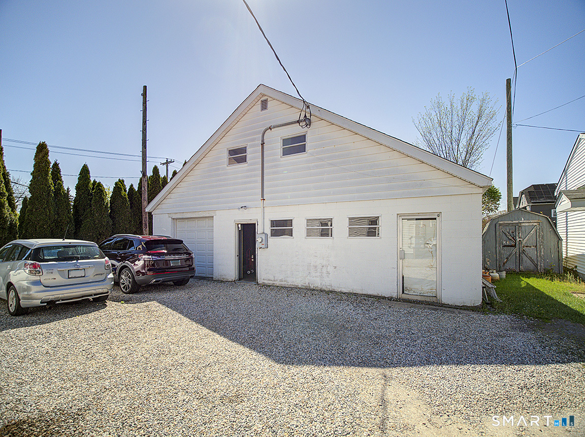 1052 Dixwell Avenue Hamden, CT 06514 - Photo 7 of 25 a view of a car park in front of house