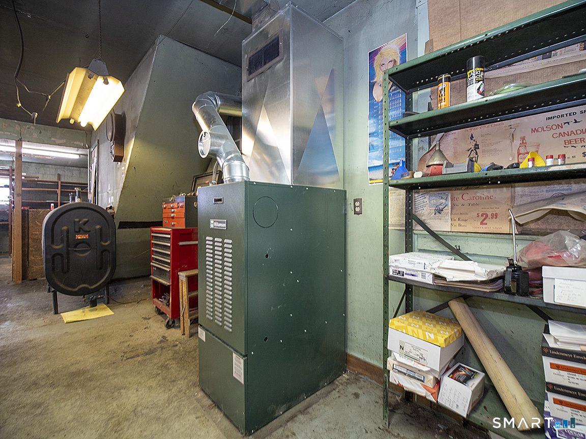 1052 Dixwell Avenue Hamden, CT 06514 - Photo 10 of 25 a view of store room with washer and dryer