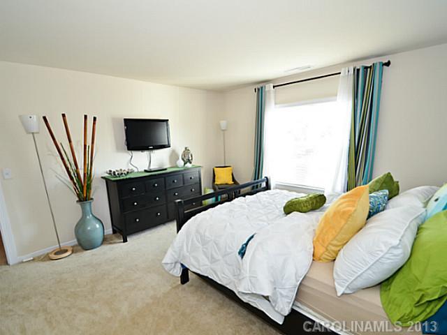 7120 Maricopa Road Charlotte, NC 28277 - Photo 14 of 16 a bedroom with a bed and flat screen tv