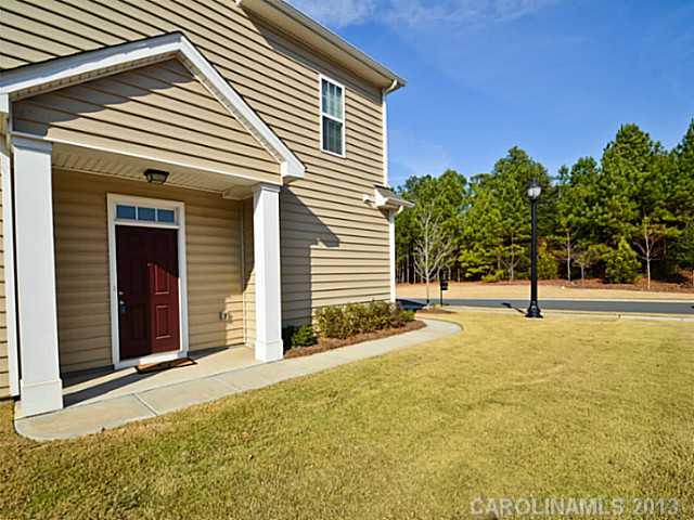 7120 Maricopa Road Charlotte, NC 28277 - Photo 16 of 16 a view of a house with backyard and trees