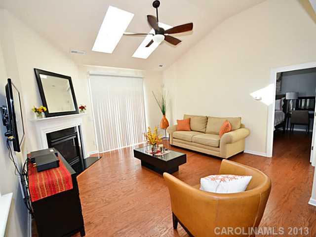 7120 Maricopa Road Charlotte, NC 28277 - Photo 5 of 16 a living room with furniture and a fireplace