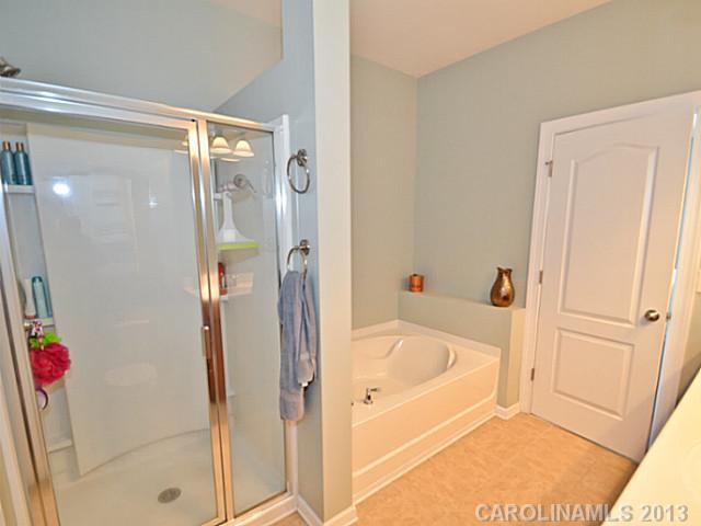 7120 Maricopa Road Charlotte, NC 28277 - Photo 9 of 16 a white bath tub sitting next to a shower